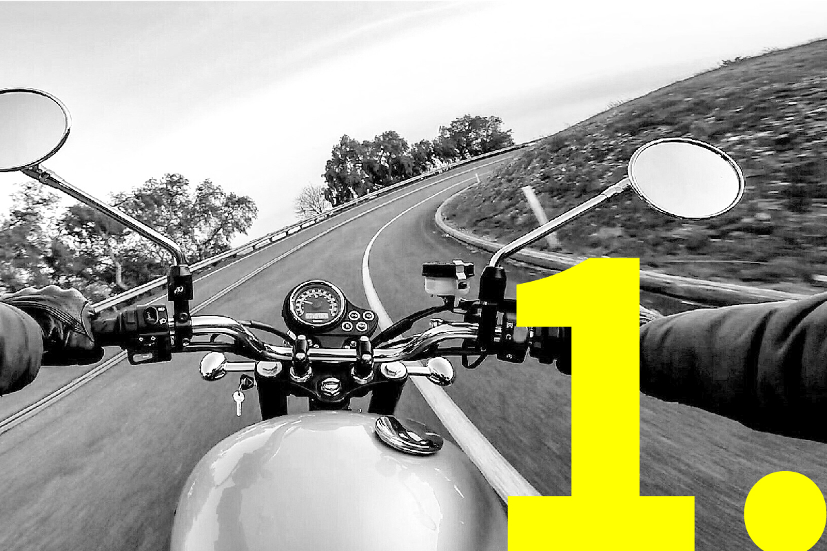 Motorcycle, photographed from the rider’s viewpoint, entering a bend on an open road between greenery, to depict the smart structure and swift adaptation of presentations.